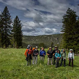 Hikers pose for a group photo in Yellowstone National Park