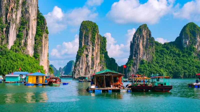 Ha Long Bay in Vietnam with boathouses and cruises