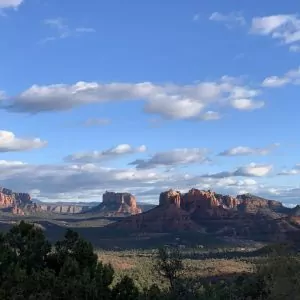 The famous rock formations that northern Arizona is known for dot the skyline with blue skies and wispy clouds