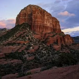 Sunset skies behind a monolith of sandstone in Sedona