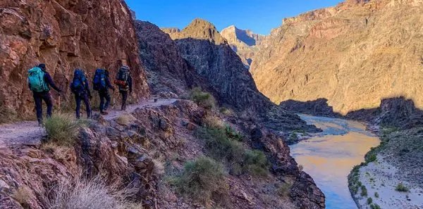 Backpackers hiking toward the bottom of the grand canyon