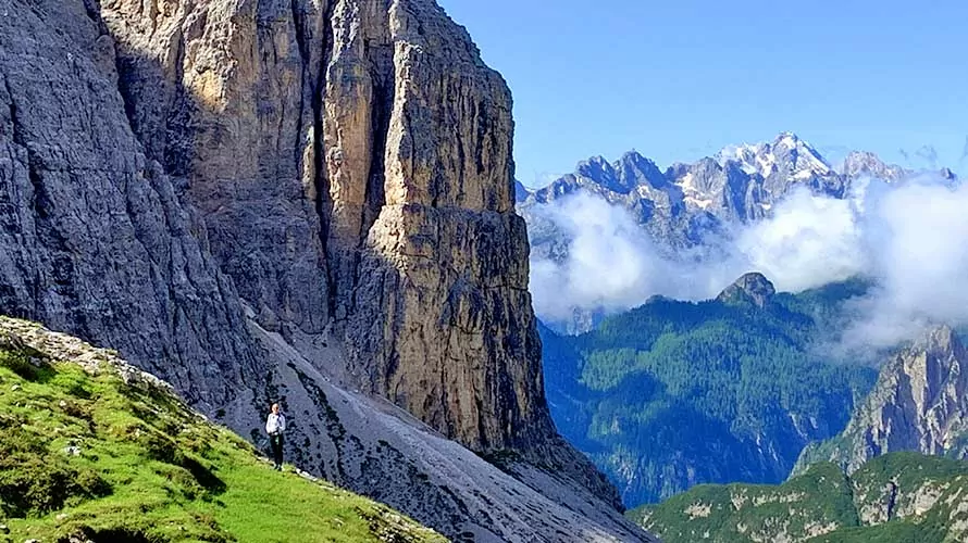Limestone alpine cliffs and snow-capped mountains in the Dolomites
