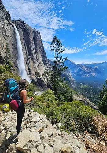 Wildland Trekking backpacker in front of Yosemite Falls