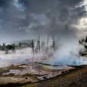 geyser yellowstone in November fall snow winter backpacking hot water