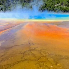 Yellowstone grand prismatic spring hot water steam orange blue yellow hot spring