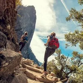 yosemite in september hiking backpacking valley group trip camping stairs sunlight women