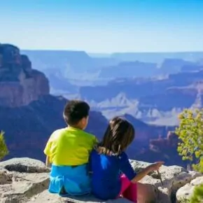 Grand Canyon best time to go with kids boy and girl overlook play hot