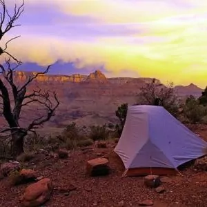 grand Canyon backpacking in May sunset tent desert tree rock