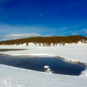 Yellowstone in December backpacking backcountry snow lake hill