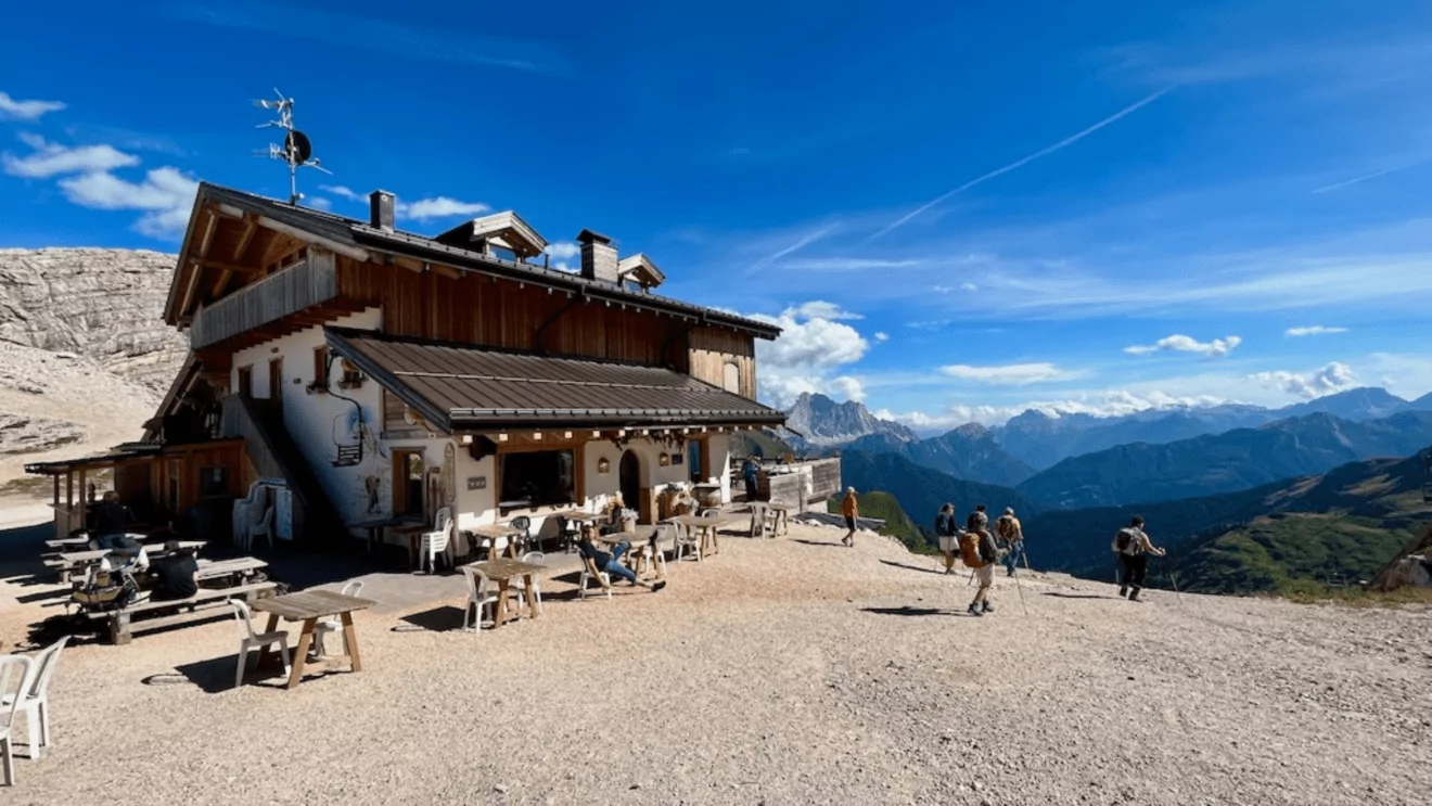 Rifugio Averau with views of Dolomites mountains and hikers