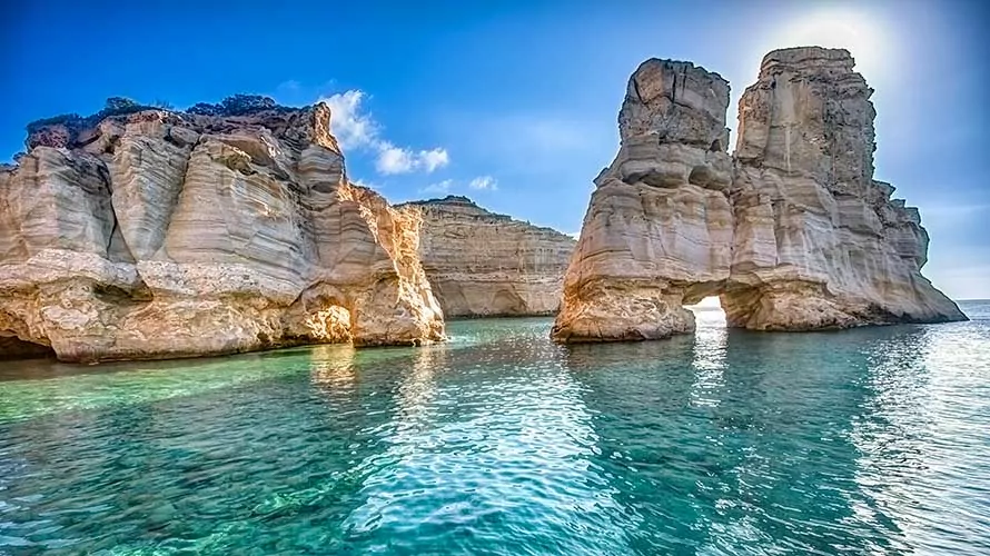 Natural rocky arches with clear transparent waters in Kleftiko, Milos island, Cyclades, Greece