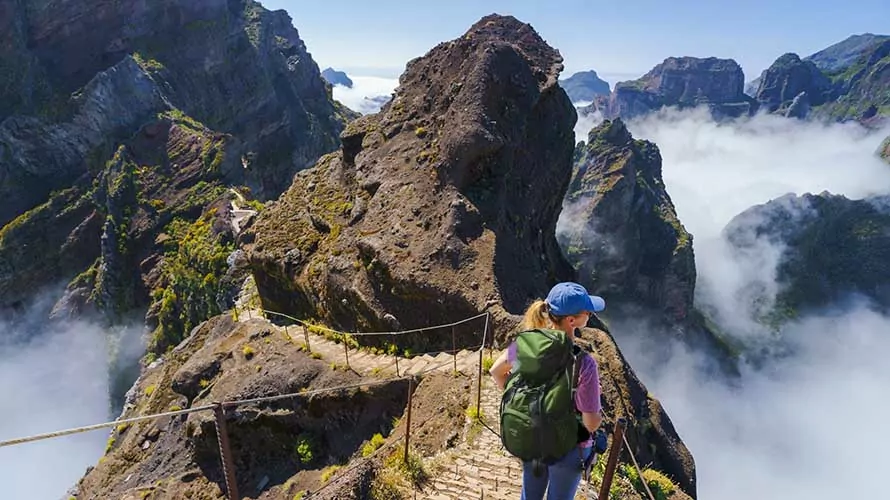 Hiker on PR1 Pico do Arieiro - Pico Ruivo trail Stairway to Heaven Madeira Portugal