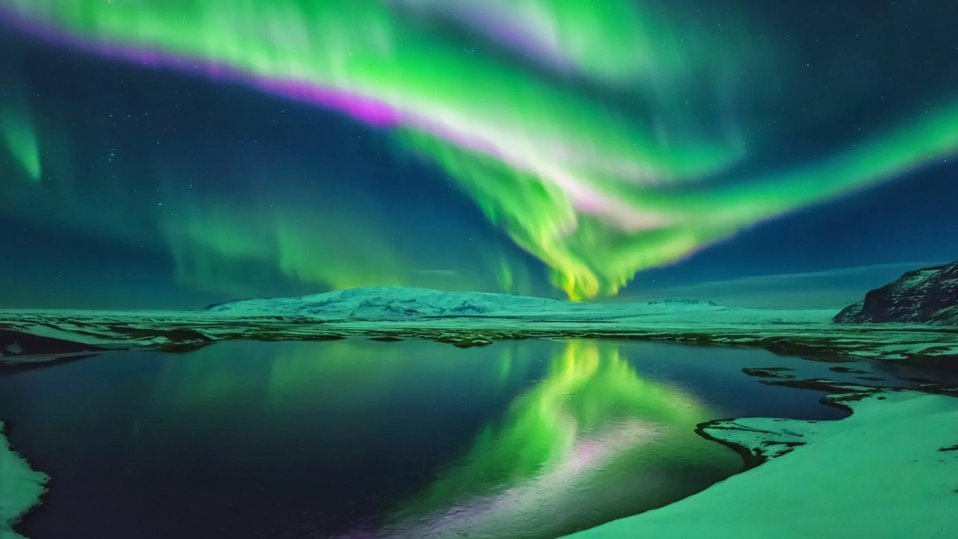 Colorful aurora borealis over Iceland in winter
