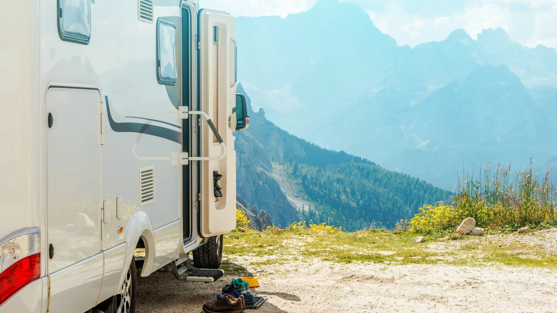 An RV is parked outlooking a beautiful view