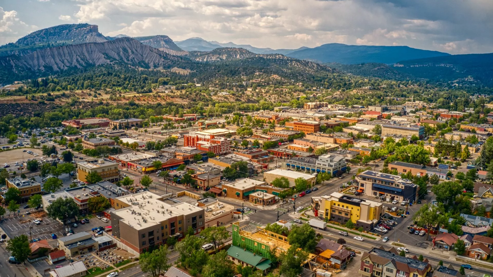 The town of Durango colorado is seen from an aerial view in autumn with mountains ringing the background