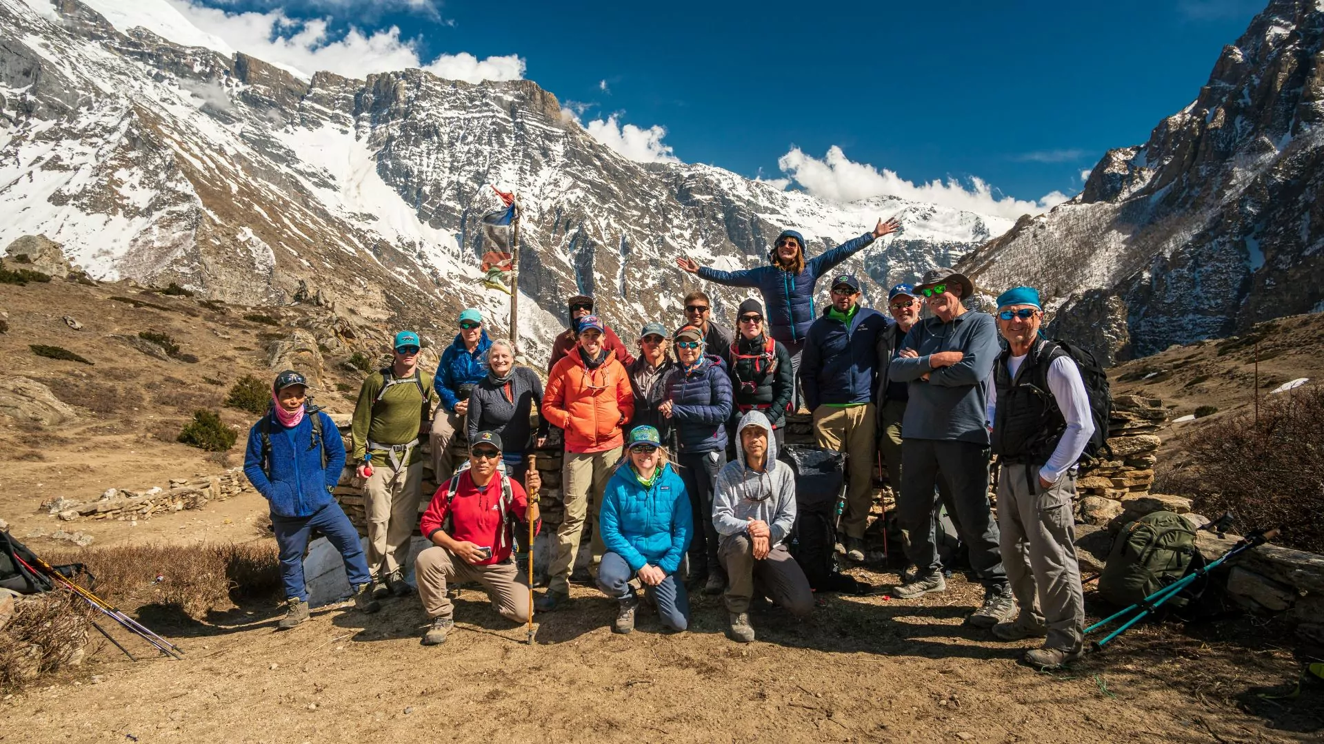 A group of volunteers poses together after a service trek in Nepal