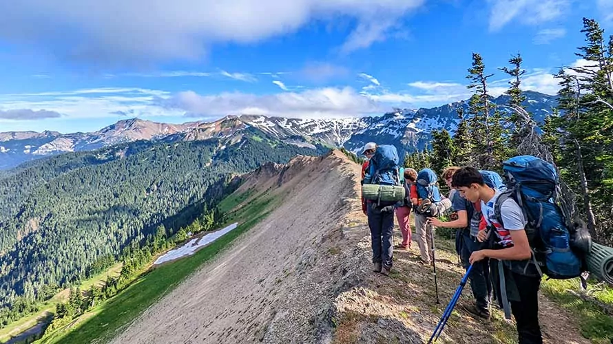 Group of backpackers on the Knife Ridge on the Pacific Crest Trail, Washington