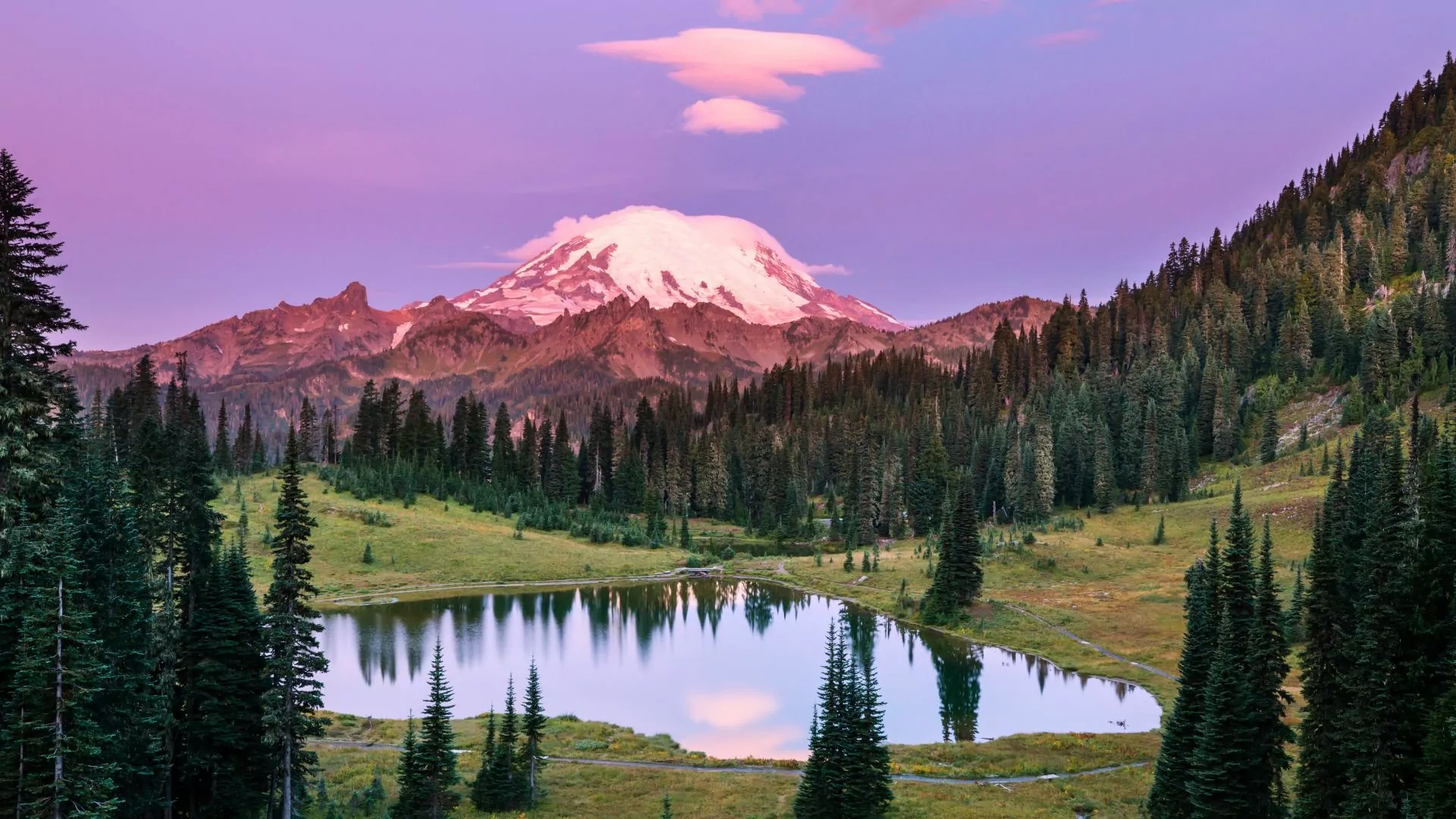 Mount Rainier reflects in a lake in Washington's Rainier National Park