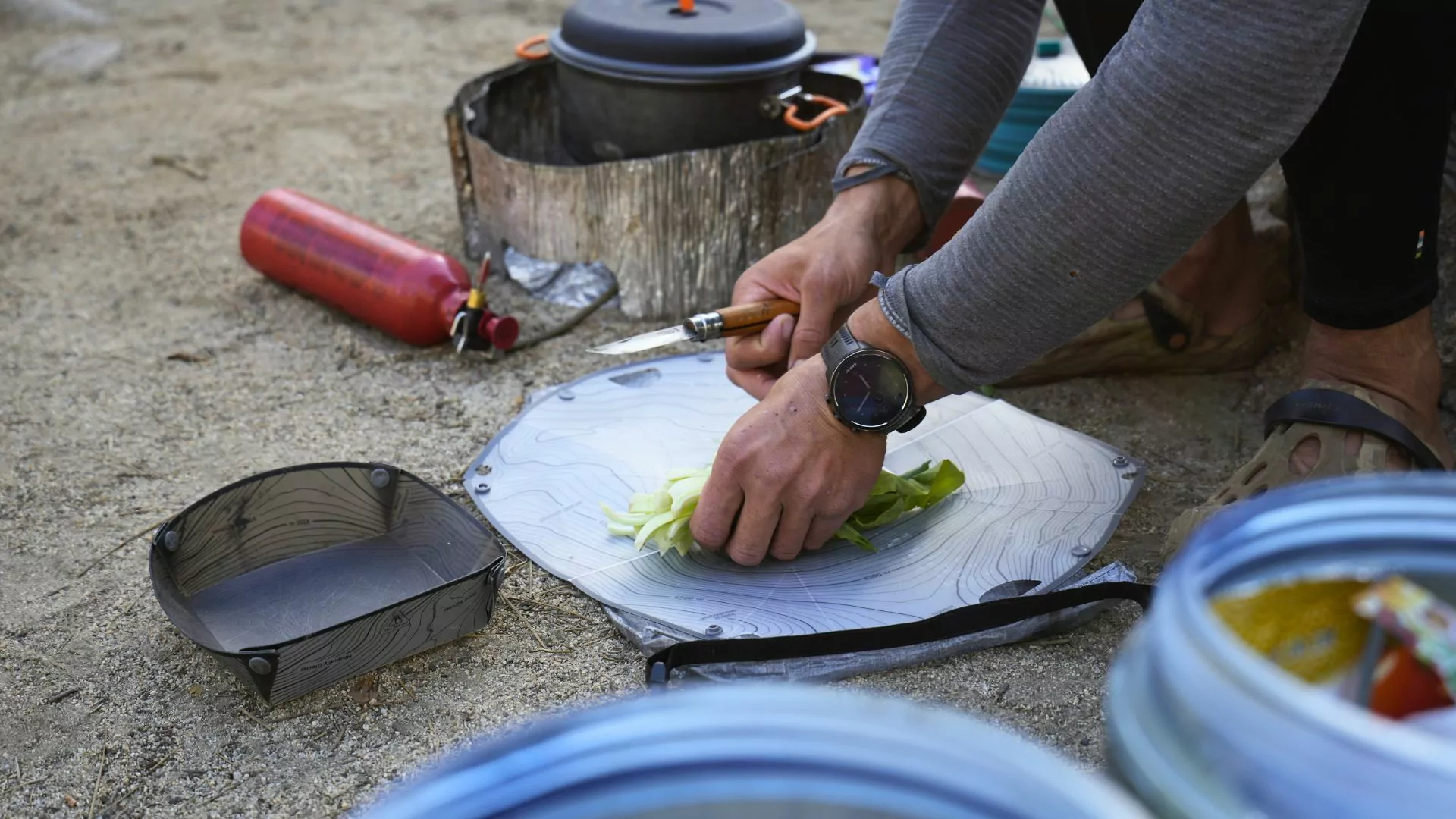 A Wildland Trekking guide prepares dinner on the trail