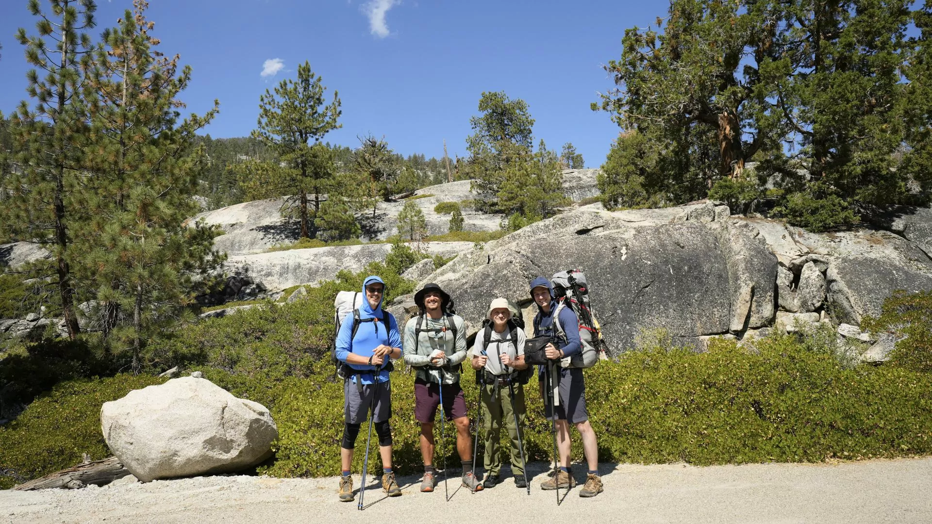 Backpacking group and guide pose before a trip