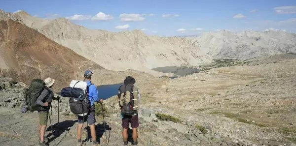 Three backpackers look at the mountains|Backpacking food|A guide cooks backpacking food|Tortillas|Instant oatmeal||Snack mix|Trail mix|Ramen