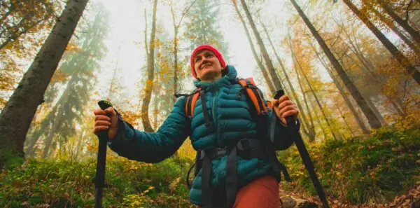 Hiker in the forest in fall