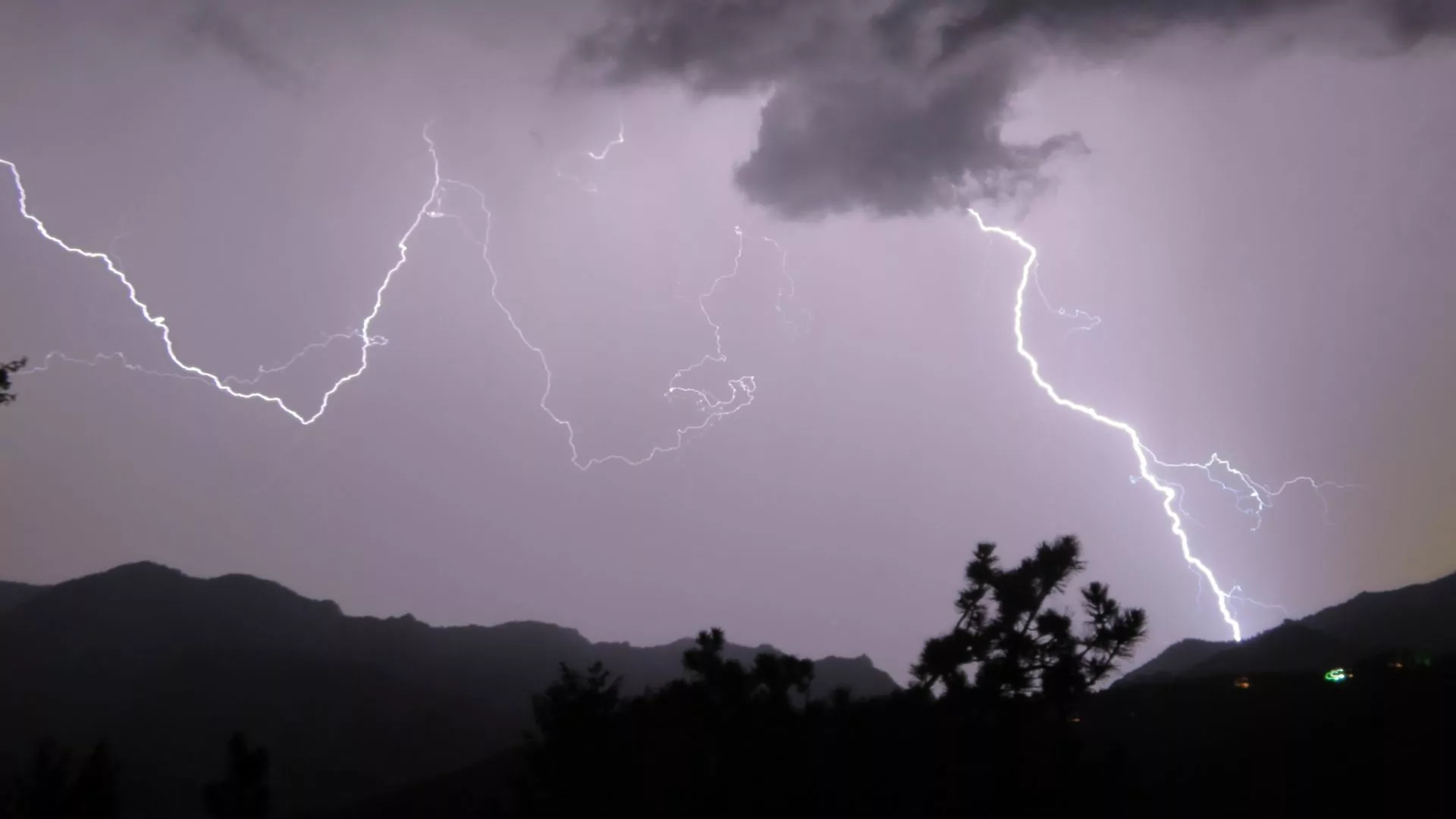 Lightning strikes over the mountains